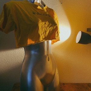 Yellow EMPYRE crop top in size small.